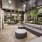 outdoor sofia lounge under an arbor structure with outdoor tv