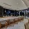 long island with 7 barstool seating and a window that opens out to the pool deck with Uptown Charlotte views