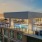 top floor pool with 18 pool chairs, two fire places with 8 chairs as well as 2 grilling stations with 2 high top dining tables and chairs